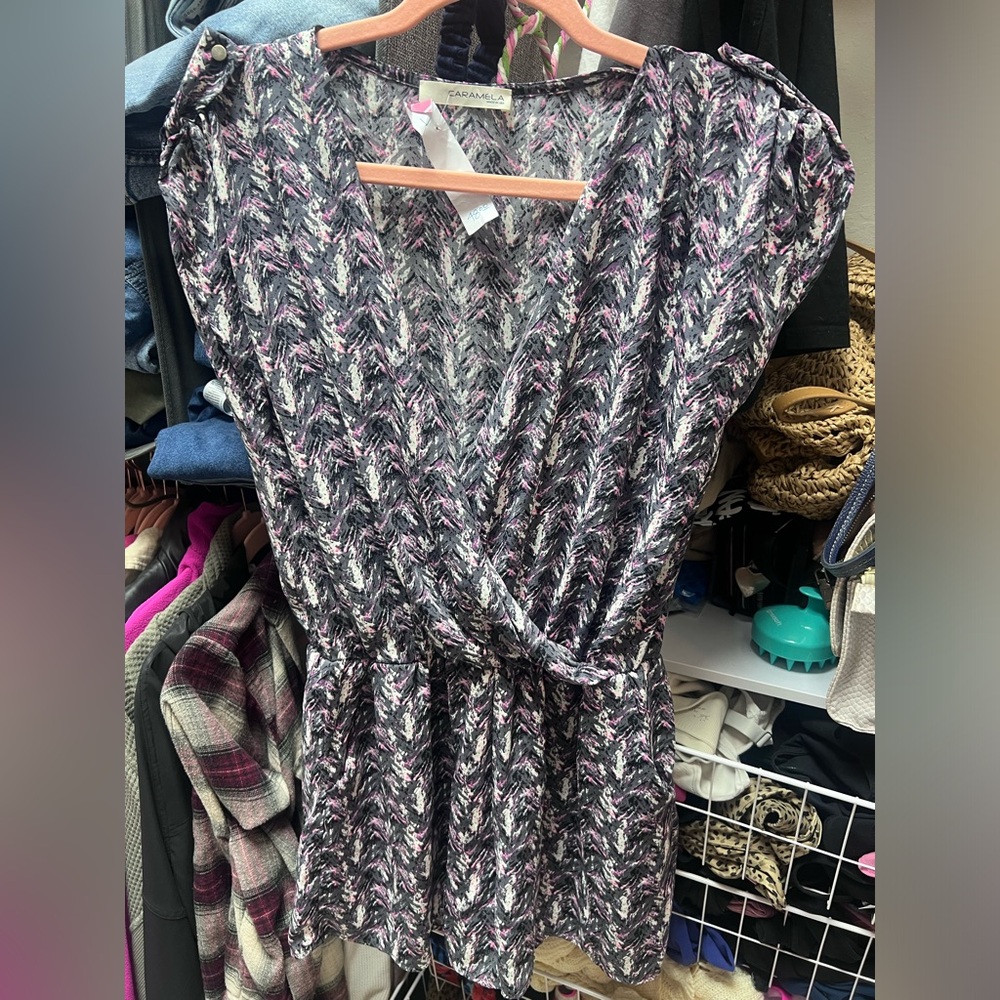 Black pink and white romper. Size L. New with tags. NWT. Has pockets.